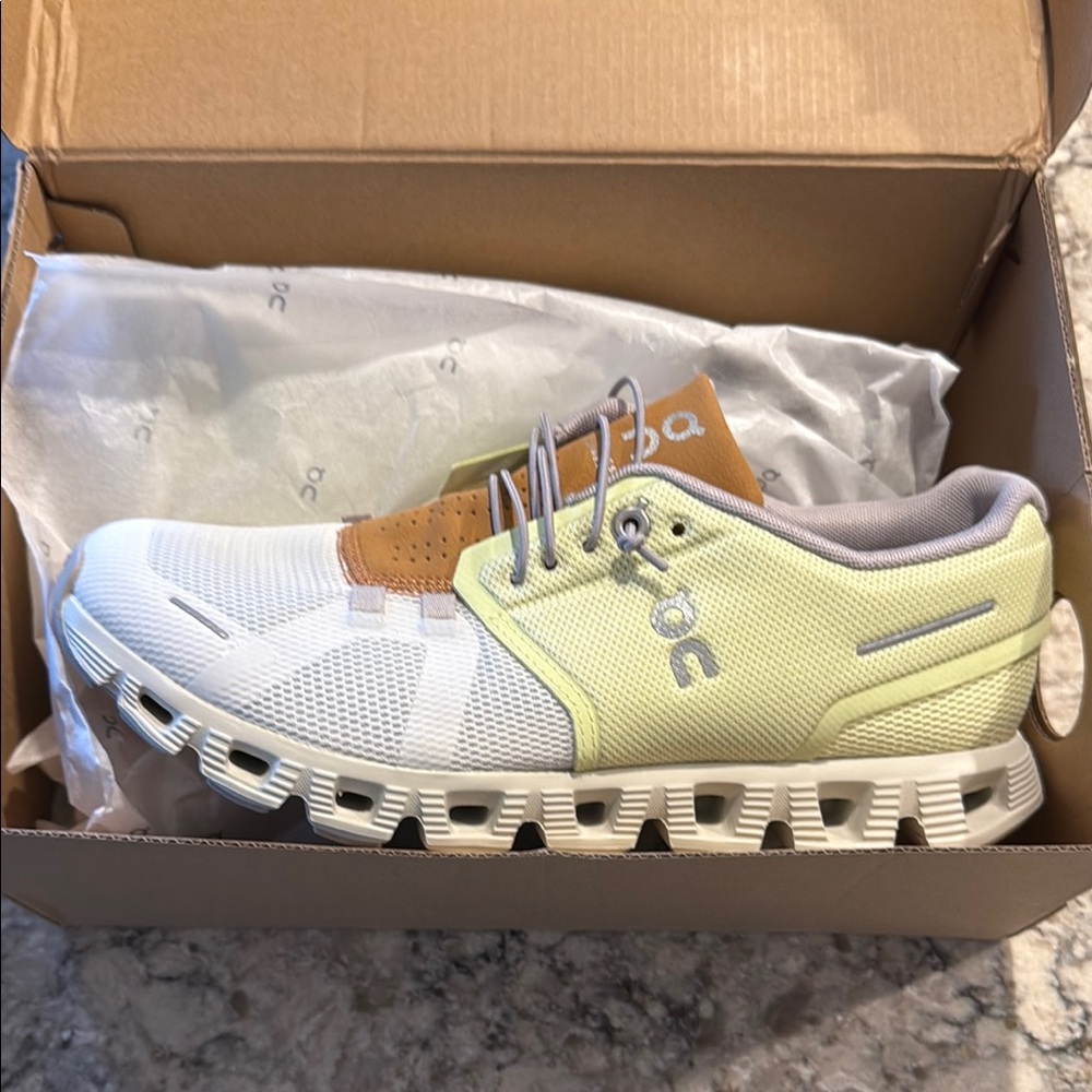 On Cloud Running womans White and Cream Sneakers